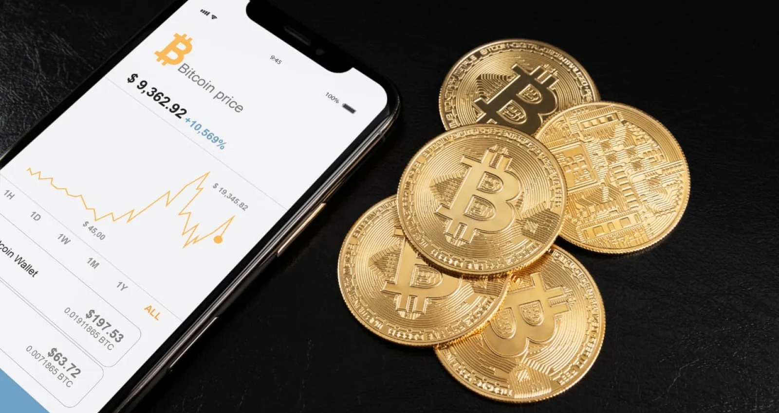 foto de un celular y unas monedas cripto