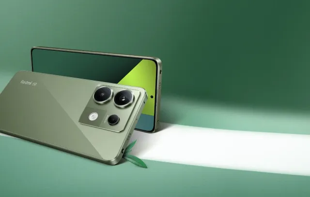 un celular de color verde olvida en un fondo verde más oscuro
